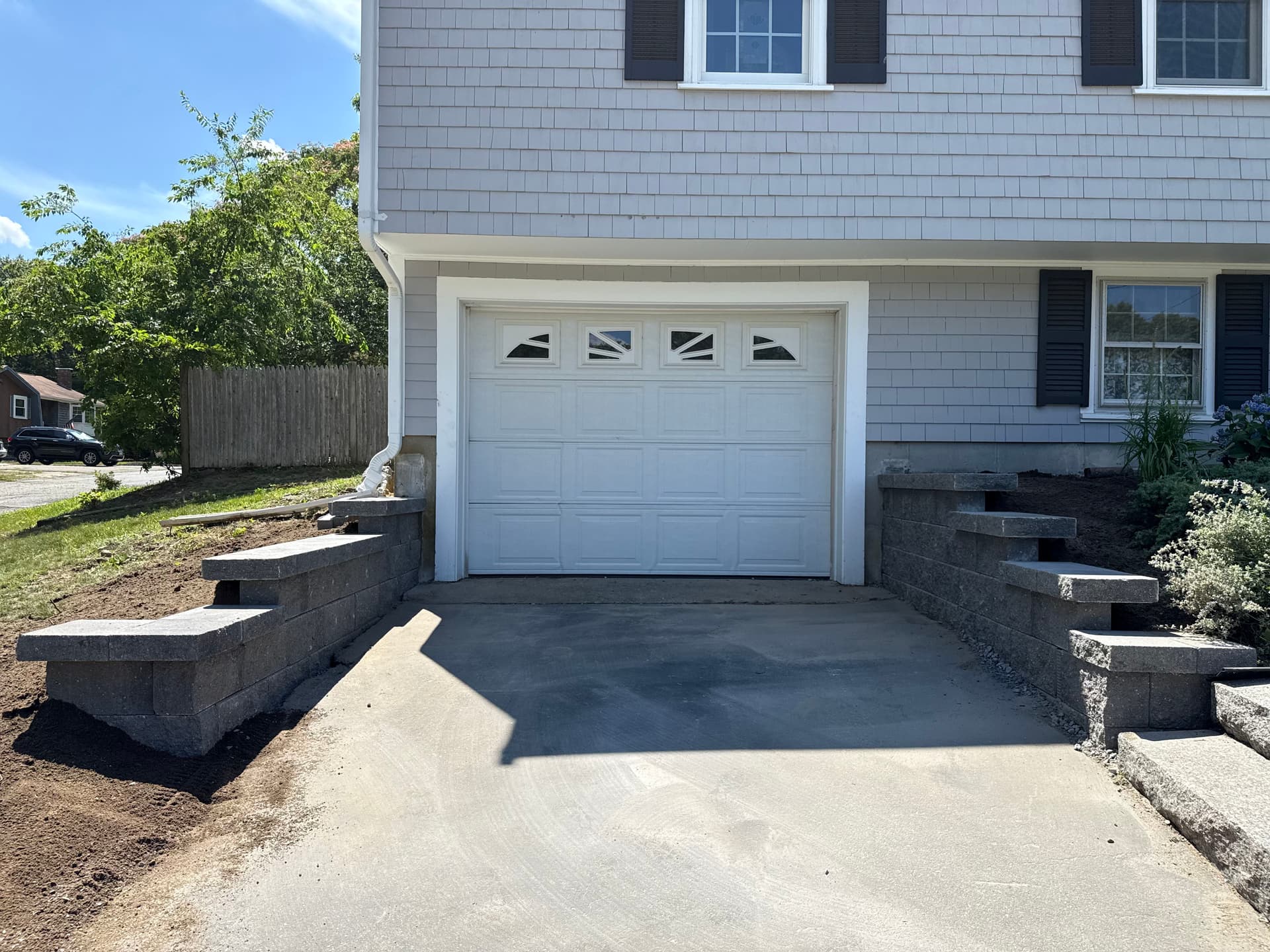Gallery photos for Two Driveway Retaining Walls Replaced with Solid Block Construction: Image #1